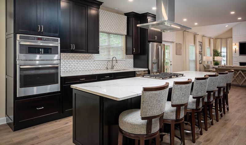 ivory countertops pair with dark wood cabinets